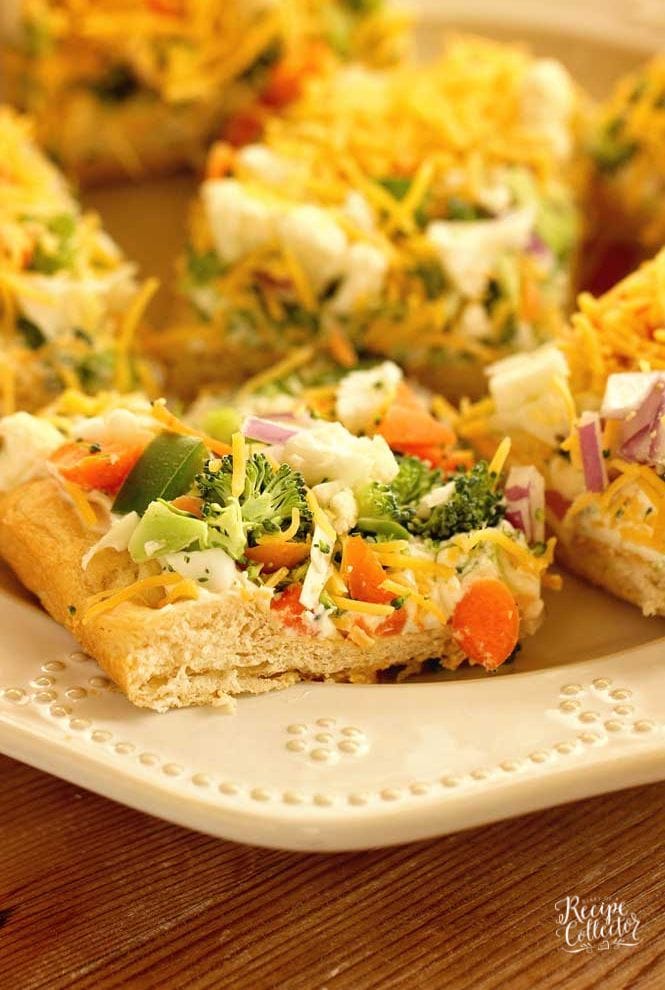 Veggie Squares -This easy appetizer is a great recipe for any get-together.  When you want a break from the ordinary vegetable tray, this is the way to go!  They are always a hit!  Crescent rolls, ranch packet, cream cheese, mayo, veggies, and shredded cheese...super easy!