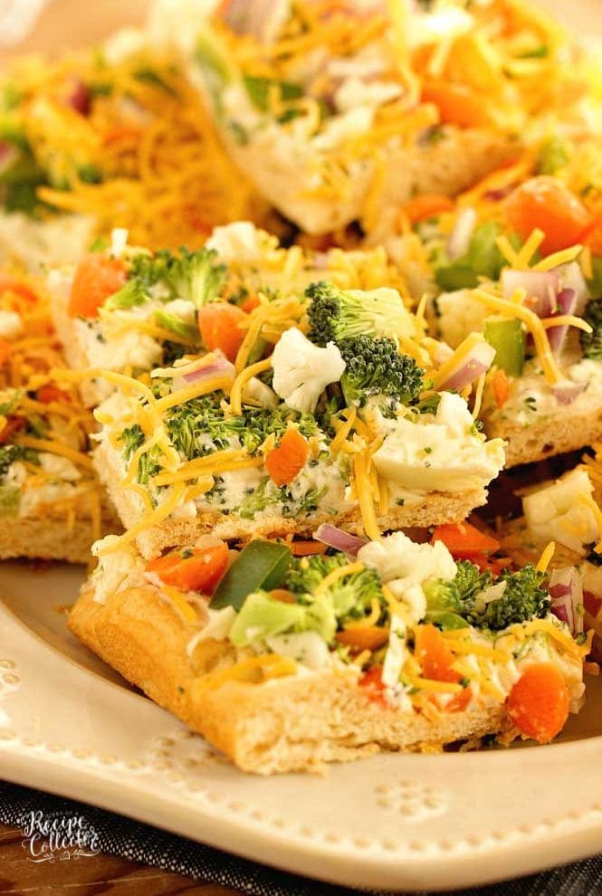 Veggie Squares -This easy appetizer is a great recipe for any get-together.  When you want a break from the ordinary vegetable tray, this is the way to go!  They are always a hit!  Crescent rolls, ranch packet, cream cheese, mayo, veggies, and shredded cheese...super easy!
