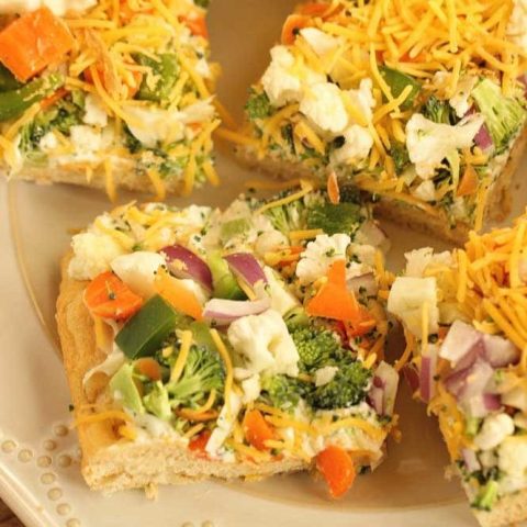 Veggie Squares -This easy appetizer is a great recipe for any get-together.  When you want a break from the ordinary vegetable tray, this is the way to go!  They are always a hit!  Crescent rolls, ranch packet, cream cheese, mayo, veggies, and shredded cheese...super easy!