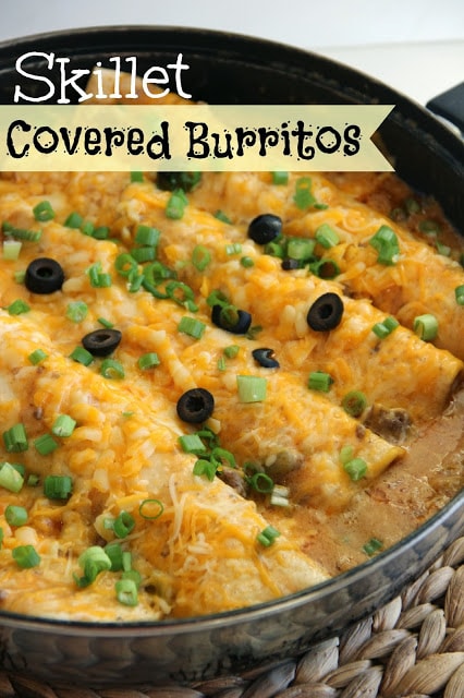 Skillet Covered Burritos - An easy one pot weeknight dinner idea filled with stuffed cheesy enchiladas surrounded in delicious chili gravy.