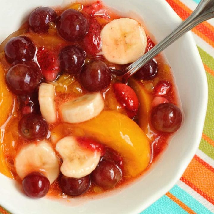 Peach Pie Filling Fruit Salad - This easy dish is made with fresh fruit, frozen strawberries, and mixed with a can of peach pie filling.  It's perfect for school lunches and freezer-friendly too!