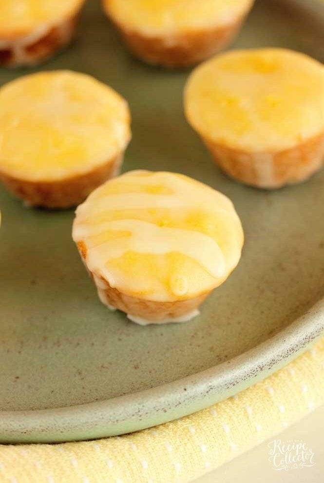 Lemon Blossoms - Mini sweet, lemony muffin treats dunked in a lemon powdered sugar glaze...perfect for a party, shower, or just because.