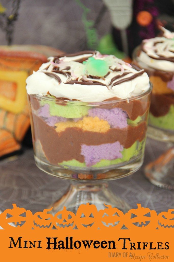 Mini Halloween Trifles - Layers of fun colored cake with pudding and topped off with some spider-webbed whipped cream!  It's a super fun dessert for your kids or grandkids, and it's really quick to put together!