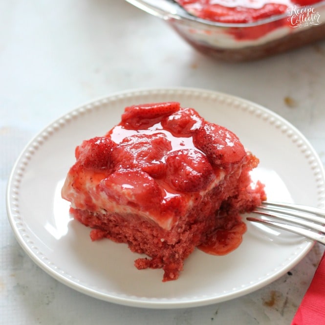 Strawberry Wet Cake - A super moist strawberry cake filled with real strawberries and strawberry jello and topped with a wonderful cream cheese icing and more strawberries!! It's perfect for a crowd!