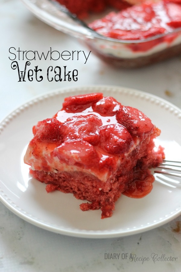 Strawberry Wet Cake - A super moist strawberry cake filled with real strawberries and strawberry jello and topped with a wonderful cream cheese icing and more strawberries!! It's perfect for a crowd!