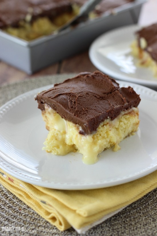 Boston Cream Pie Poke Cake - Major crowd-pleasing cake filled with vanilla pudding and sweetened condensed milk and topped with a homemade chocolate frosting!!