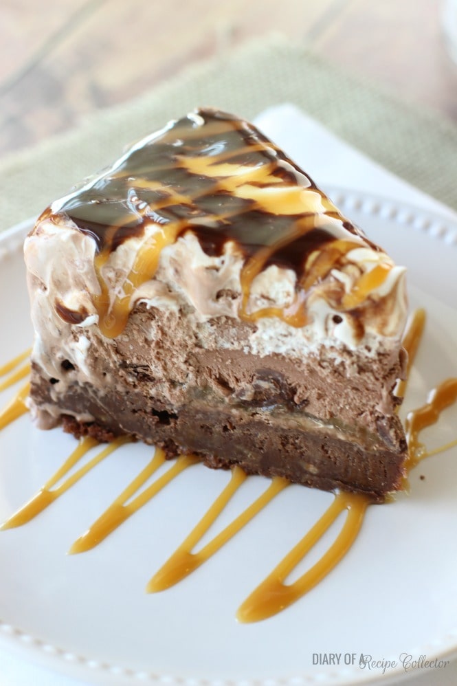 Salted Caramel Brownie Ice Cream Cake - Layers of rich brownie filled with toffee, salted caramel, dark chocolate truffles, chocolate ice cream, and whipped cream topped with drizzles of chocolate syrup and more salted caramel. 