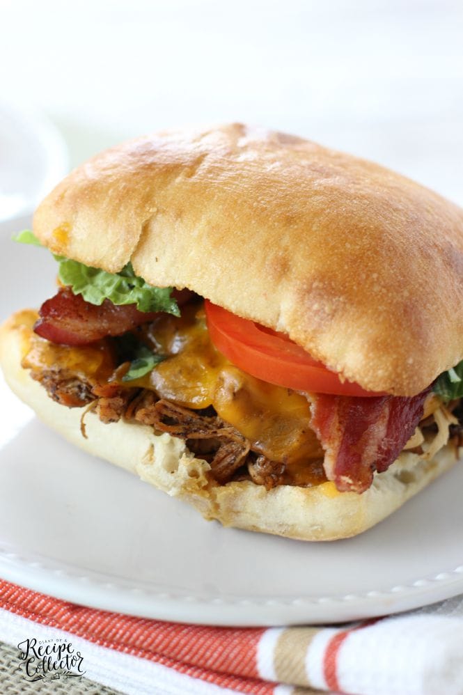 Slow Cooker Balsamic Chicken Sandwiches - Served on a toasted ciabatta roll and topped with bacon and cheddar cheese with a roasted garlic mayo. They are so good!