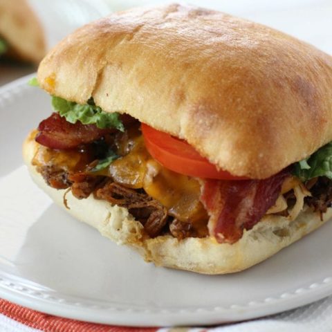 Slow Cooker Balsamic Chicken Sandwiches - Served on a toasted ciabatta roll and topped with bacon and cheddar cheese with a roasted garlic mayo. They are so good!