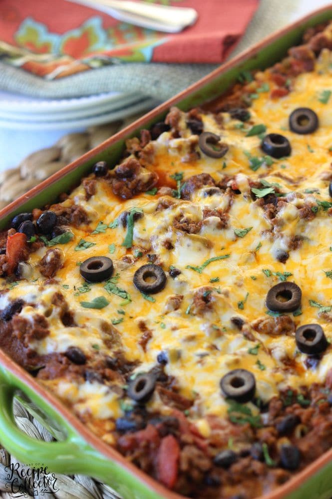 Mexican Lasagna - A hearty casserole filled with ground sirloin, three cheeses, lasagna noodles, tomatoes, and all those wonderful Mexican flavors- Diary of a Recipe Collector