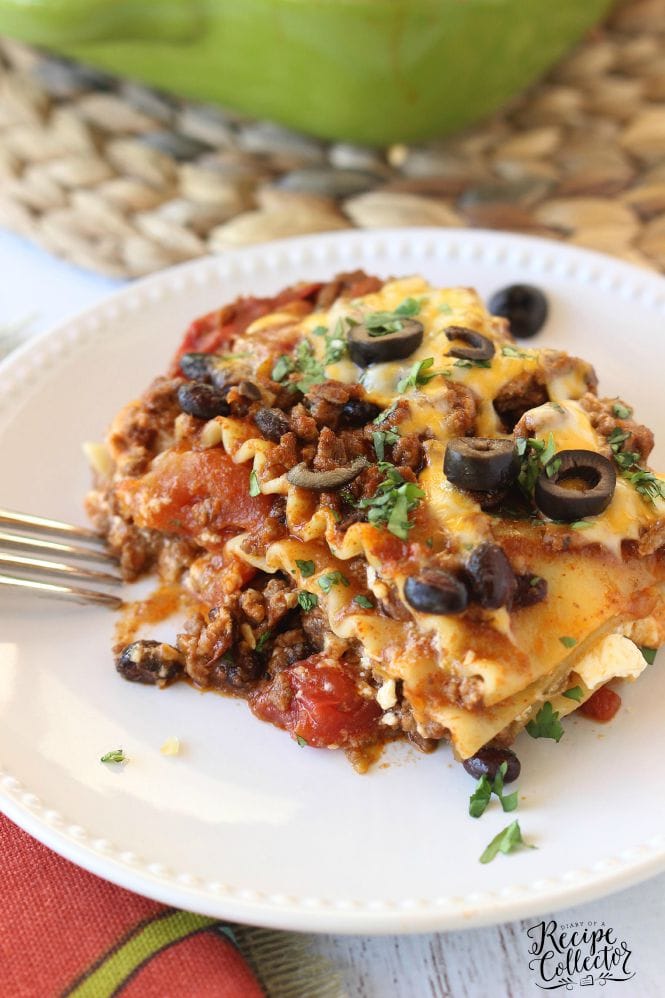 Mexican Lasagna - A hearty casserole filled with ground sirloin, three cheeses, lasagna noodles, tomatoes, and all those wonderful Mexican flavors- Diary of a Recipe Collector