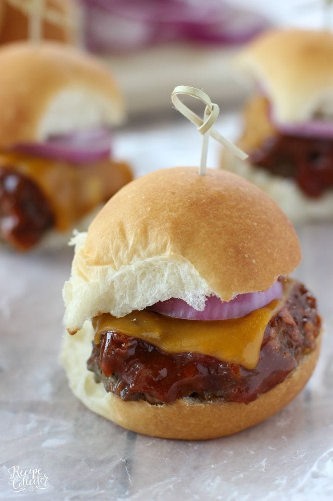 Barbecue Meatloaf & Cheddar Oven Sliders - Baked meatloaf slider burgers topped with a wonderful homemade easy barbecue sauce, cheddar cheese, and red onion. Perfect for game day!