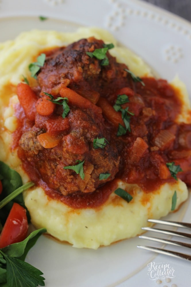 Zucchini Meatballs & Tomato Gravy - A perfect way to sneak those vegetables into meatballs! Plus they are served with a delicious tomato gravy and carrots. They are perfect served over mashed potatoes. 