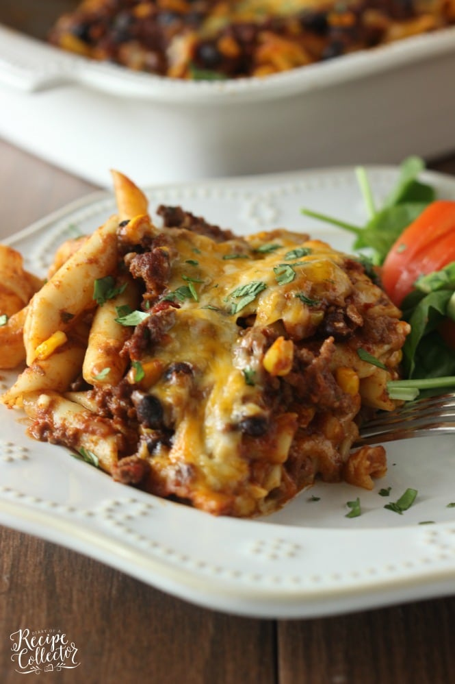Mexican Baked Ziti – A comforting casserole filled with pasta, ground beef, cheese, Ragu sauce, black beans, and corn. 