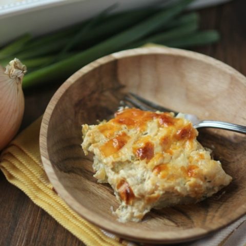 Cheesy Onion Scalloped Potatoes - Layers of thinly sliced potatoes in a rich and creamy sauce filled with caramelized onion flavor.