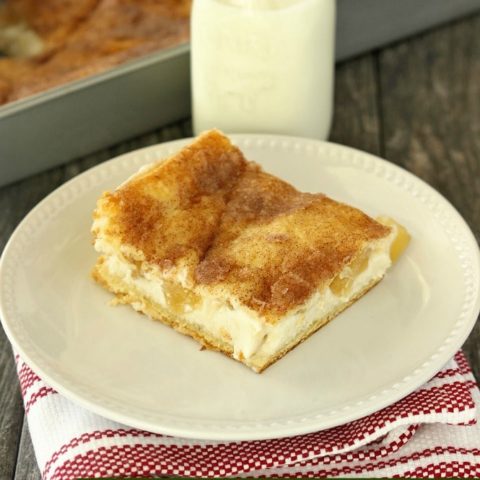 Crescent Apple Cheesecake - Canned refrigerated crescent rolls filled with cheesecake and apples, baked until golden, and sprinkled with cinnamon and sugar.