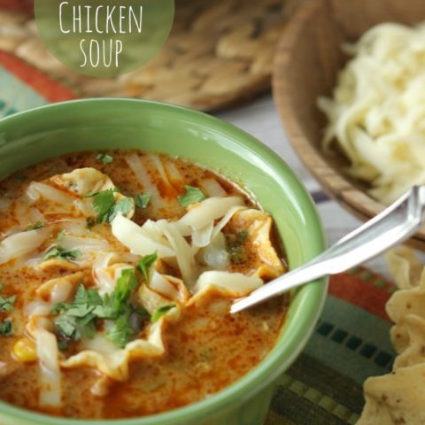 Cheesy Chicken Tortilla Soup - Comforting soup filled with chicken, onions, peppers, black beans, corn, and finished off with a little cream to give it that extra little something!