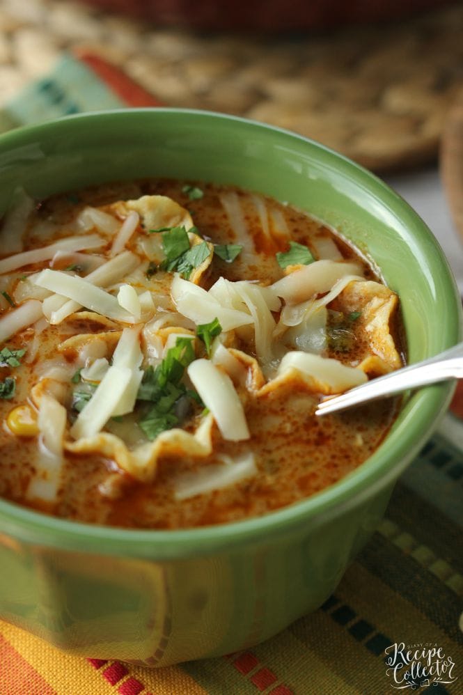 Cheesy Chicken Tortilla Soup - Comforting soup filled with chicken, onions, peppers, black beans, corn, and finished off with a little cream to give it that extra little something!