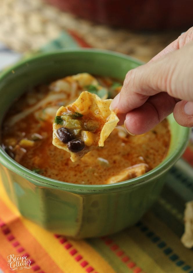 Cheesy Chicken Tortilla Soup - Comforting soup filled with chicken, onions, peppers, black beans, corn, and finished off with a little cream to give it that extra little something!