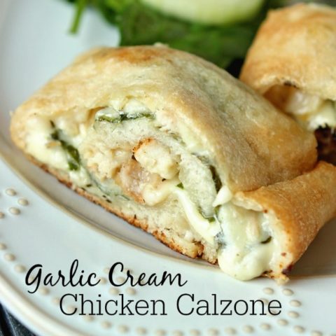Garlic Cream Chicken Calzone - Pizza crust stuffed and rolled up with grilled chicken, spinach, jack cheese, and a garlic cream sauce.