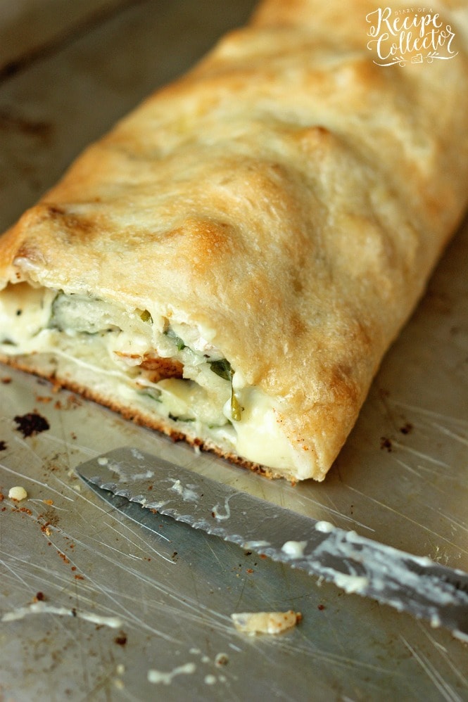 Garlic Cream Chicken Calzone - Pizza dough stuffed and rolled up with grilled chicken, spinach, jack cheese, and a garlic cream sauce.