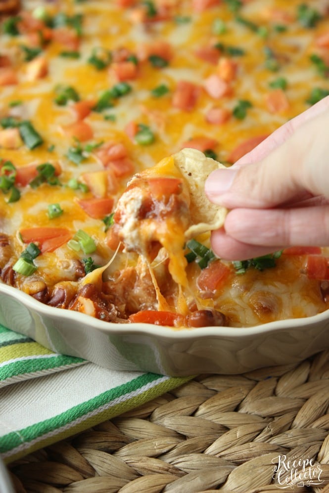 Hot Bean & Cheese Dip - A quick oven-baked dip made with cream cheese, chili beans, salsa, and melty cheese!
