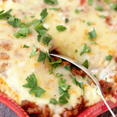 Italian Ravioli Pasta Bake - Layers of meat sauce, cheese ravioli, spinach, and cheese baked up to perfection.