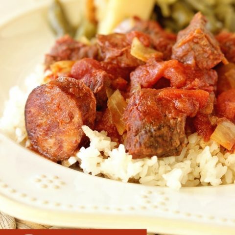 Slow Cooker Sauce Piquante - An easy and delicious slow cooker recipe filled with tomatoes, smoked pork sausage, and beef stew meat. Perfect served over rice!