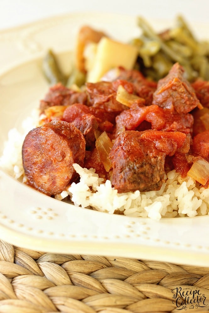 Slow Cooker Sauce Piquante - An easy and delicious slow cooker recipe filled with tomatoes, smoked pork sausage, and beef stew meat. Perfect served over rice!