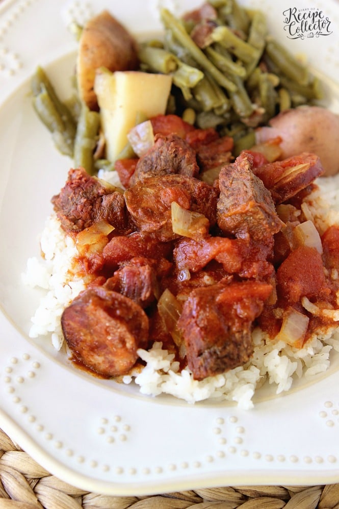 Slow Cooker Sauce Piquante - An easy and delicious slow cooker recipe filled with tomatoes, smoked pork sausage, and beef stew meat. Perfect served over rice!