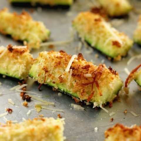 Parmesan Crusted Zucchini Oven Fries - Sliced zucchini coated with panko breadcrumbs and shredded Parmesan roasted in the oven. It makes a perfect healthy side dish.