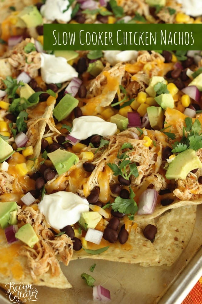 Slow Cooker Chicken Nachos - Chicken breasts cooked with a homemade salsa in the slow cooker, black beans, corn, red onion, and diced avocados piled on corn tortilla chips and broiled to create an easy Mexican dinner!