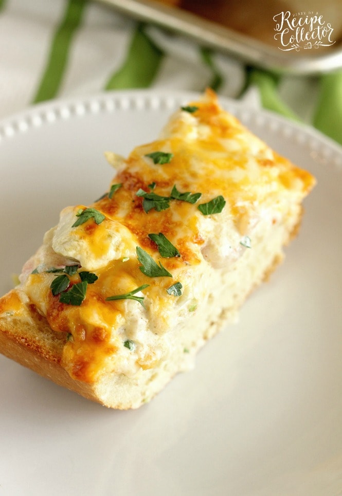 Shrimp & Artichoke French Bread - A perfect appetizer made with a cheesy, creamy topping filled with shrimp and artichokes!