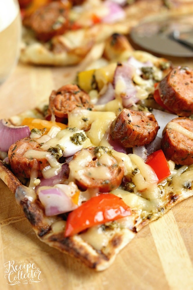 Grilled Sausage & Pepper Pizza - Grill your pizza and top it with delicious Italian Style Smoked Chicken Sausage, peppers, onions, basil pesto, and Fontina cheese.