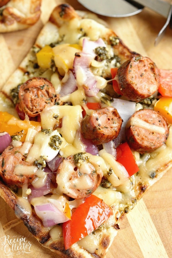 Grilled Sausage & Pepper Pizza - Grill your pizza and top it with delicious Italian Style Smoked Chicken Sausage, peppers, onions, basil pesto, and Fontina cheese.