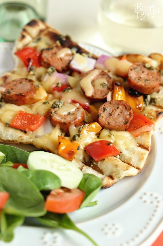 Grilled Sausage & Pepper Pizza - Grill your pizza and top it with delicious Italian Style Smoked Chicken Sausage, peppers, onions, basil pesto, and Fontina cheese.