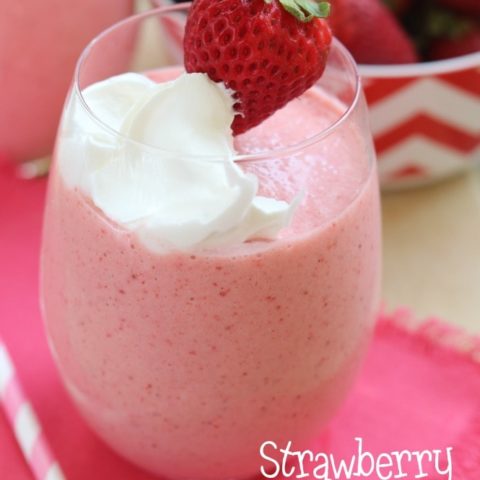 Strawberry Fiesta Daiquiri - A perfect summer cocktail made with frozen strawberries, pina colada mix, coconut rum, and cool whip! It's a creamy, fun, and delicious drink perfect for summer parties by the pool. Plus it can easily be made non-alcoholic too!