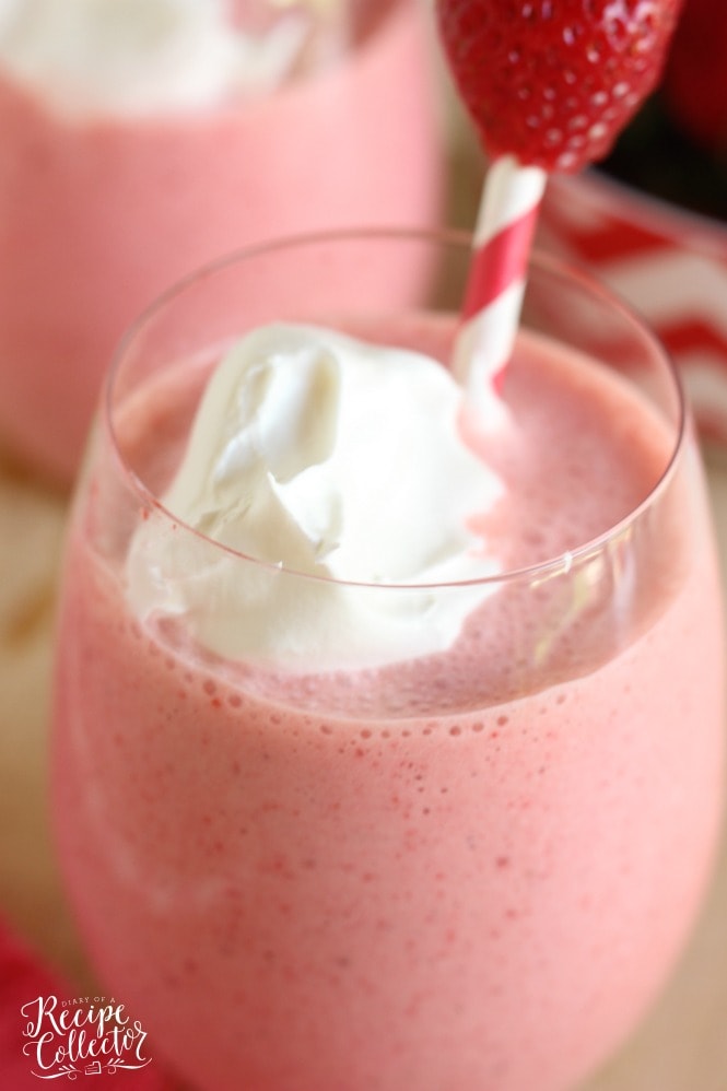 Strawberry Fiesta Daiquiri - A perfect summer cocktail made with frozen strawberries, pina colada mix, coconut rum, and cool whip! It's a creamy, fun, and delicious drink perfect for summer parties by the pool. Plus it can easily be made non-alcoholic too!