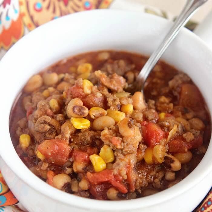 Sausage & Black Eyed Pea Chili - A hearty dinner idea filled with ground beef, black-eyed peas, corn, diced tomatoes, and breakfast sausage! It's quick, easy, and delicious!
