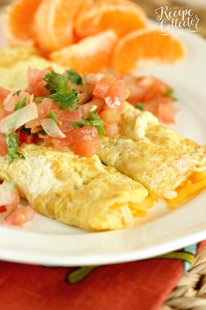 Egg Crepes - A simple, breakfast egg crepe filled with cheese and topped with pico de gallo. It's an easy and perfect breakfast recipe when you are trying to cut the carbs!