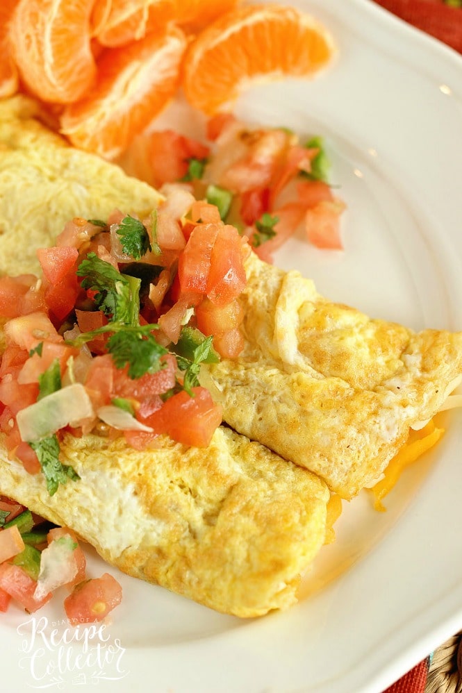 Egg Crepes - A simple, breakfast egg crepe filled with cheese and topped with pico de gallo. It's an easy and perfect breakfast recipe when you are trying to cut the carbs!