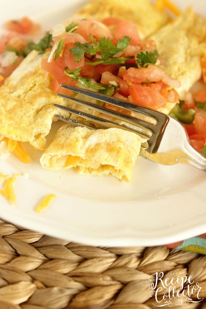 Egg Crepes - A simple, breakfast egg crepe filled with cheese and topped with pico de gallo. It's an easy and perfect breakfast recipe when you are trying to cut the carbs!