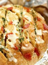 Cheesy Pepperoni Garlic Pull Apart Bread is a packed with tons of garlic herb flavor and makes the perfect appetizer and snack idea!