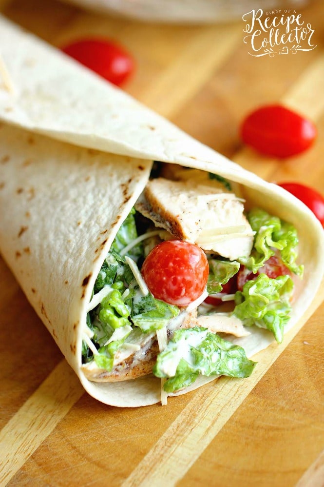 Chicken Caesar Wrap - A quick and easy lunch or dinner recipe filled with grilled chicken, chopped romaine, grape tomatoes, Parmesan cheese, and caesar dressing.  They are great to make ahead for your week too!