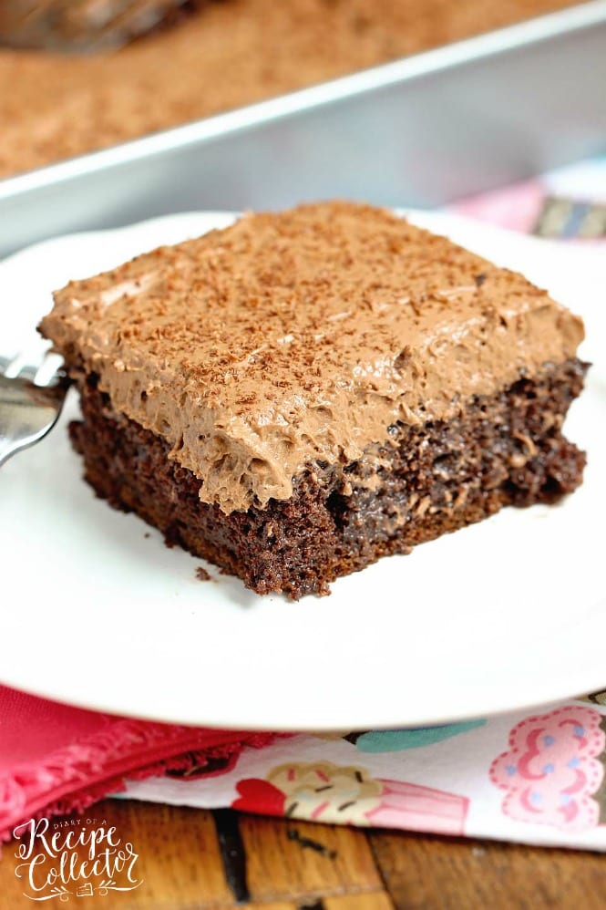 Double Mocha Poke Cake - An easy poke cake recipe using a box cake mix doctored up with pudding mix and expresso powder. It's topped with a heavenly mocha pudding whipped icing!