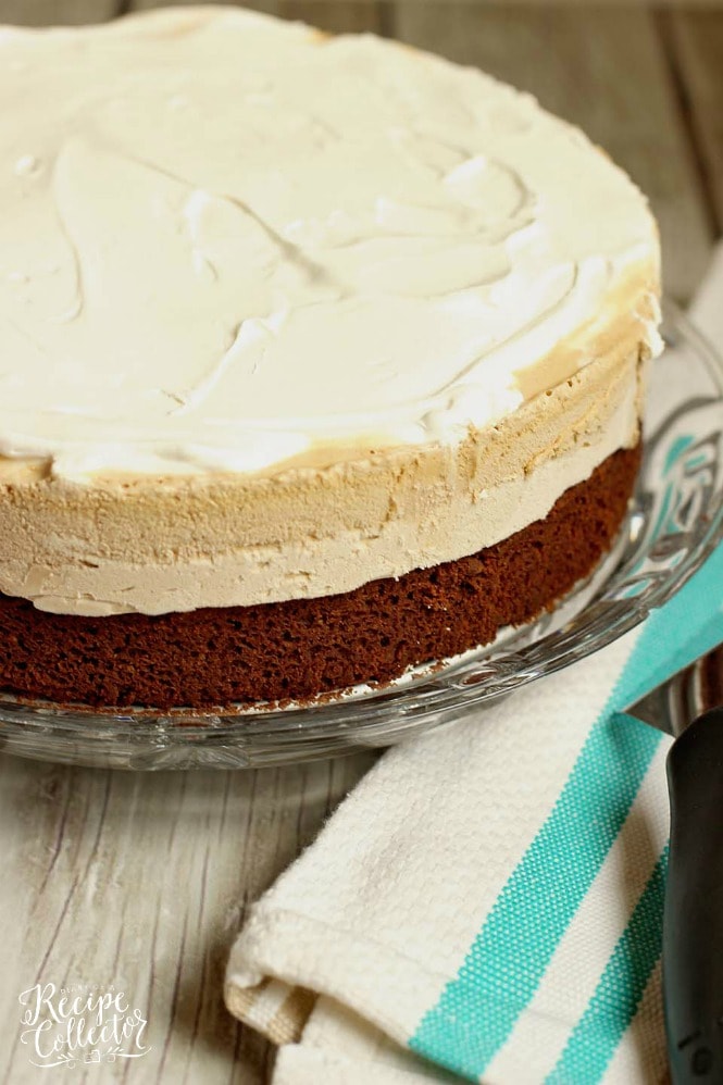 Mocha Brownie Ice Cream Cake - Layers of delicious brownie, coffee cream cheese , coffee ice cream, and whipped topping.  If you love an iced mocha frappe, then you will love this dessert!