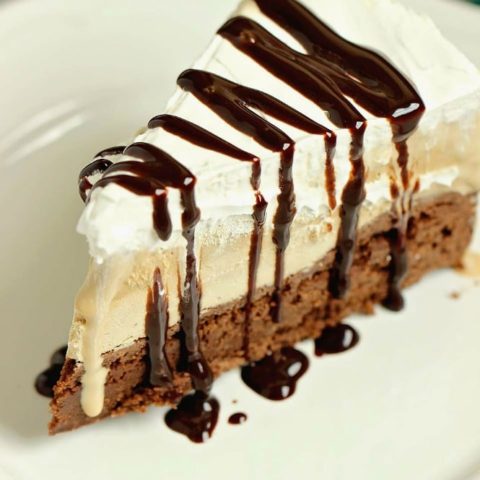 Mocha Brownie Ice Cream Cake - Layers of delicious brownie, coffee cream cheese , coffee ice cream, and whipped topping.  If you love an iced mocha frappe, then you will love this dessert!