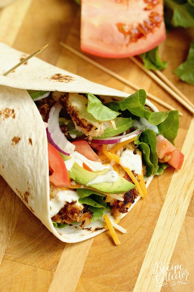 Crispy Chicken Wrap - Stuffed with panko-coated chicken, diced tomatoes, sliced red onion, avocado, shredded cheese, and ranch dressing.  It makes a great weeknight dinner or lunch idea!