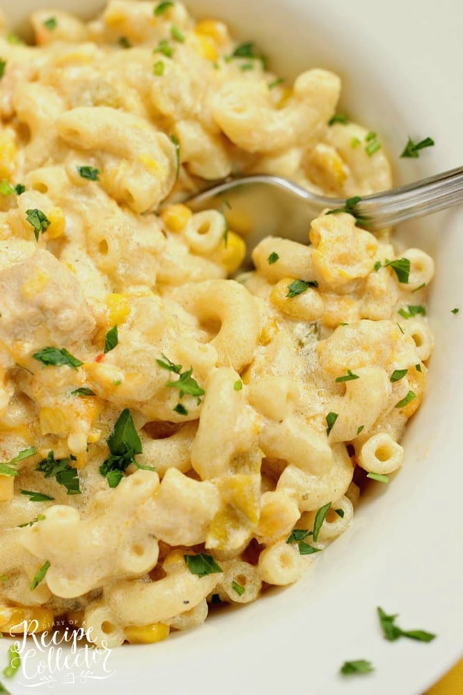 Green Chile Chicken Mac and Cheese - This hearty all-in-one macaroni and cheese dinner idea is filled with chicken, green chiles, corn, and of course all the creamy cheese!