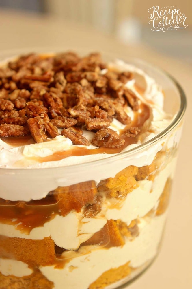Pumpkin Praline Trifle - This is the ultimate fall dessert recipe with layers of easy pumpkin cake, cream cheese pudding, caramel, and praline pecans. It's delicious made ahead and great for the busy holiday dinners!